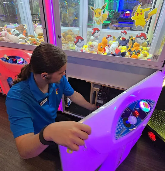 Pinball machine servicing by Desert Arcade technician